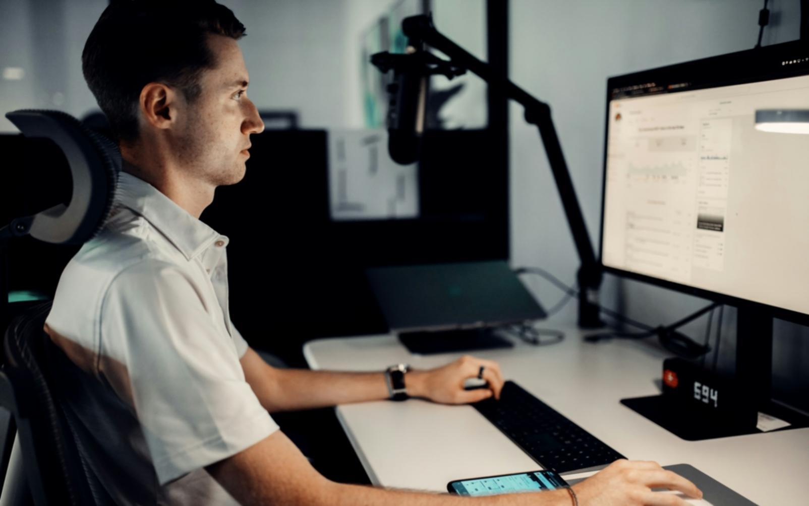 Financial analyst reviewing detailed spreadsheet data with multiple metrics